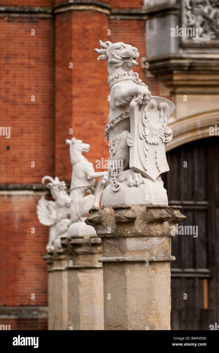 Heraldic Statues at the main entrance of Hampton Court Palace, Surrey, UK Stock Photo