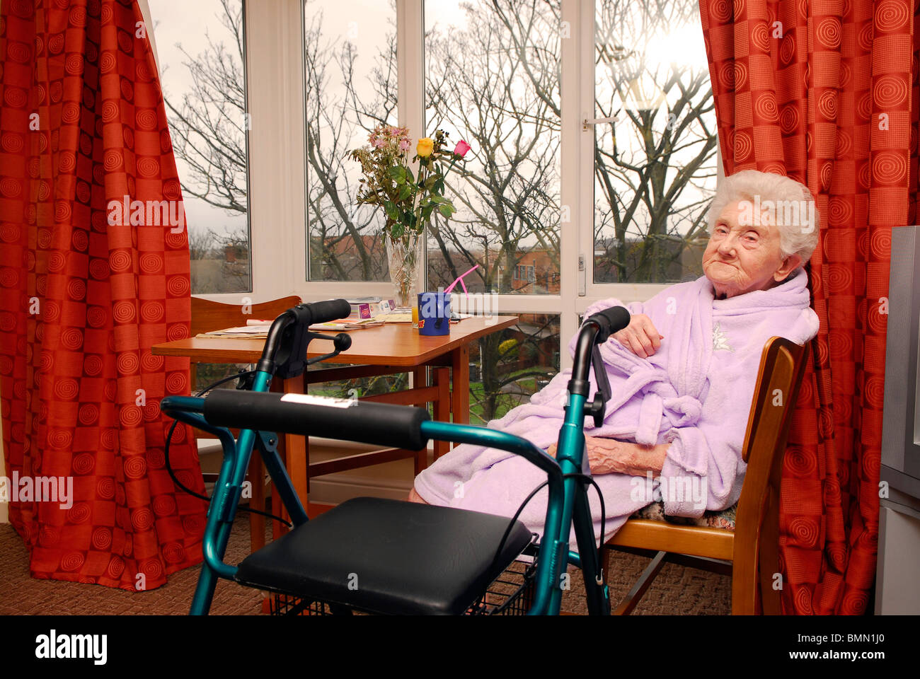 Elderly resident in her room at an old people's home, Wirral, UK. Stock Photo