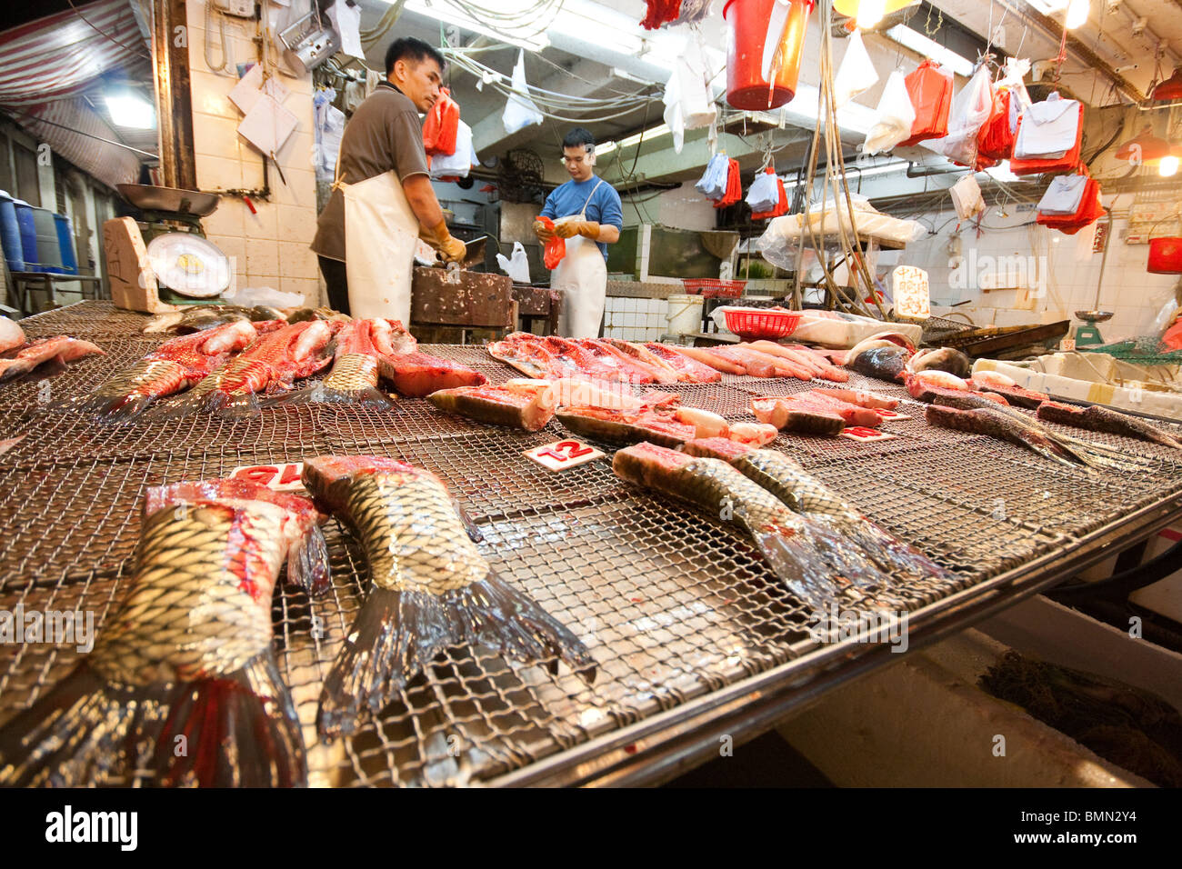 Fishes and seafood on display in shop in fish market in Hong Kong Stock