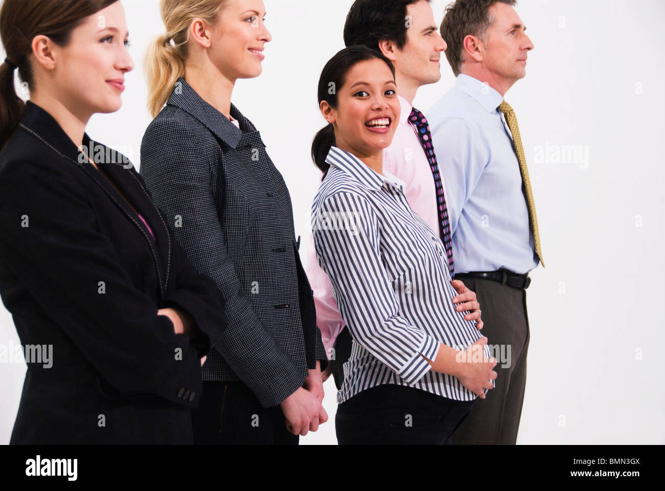 Pregnant happy women in line of people Stock Photo