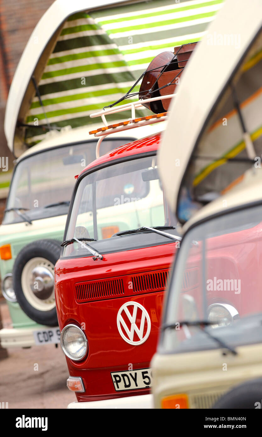 Several classic VW camper vans lined up ready for their travels. Stock Photo