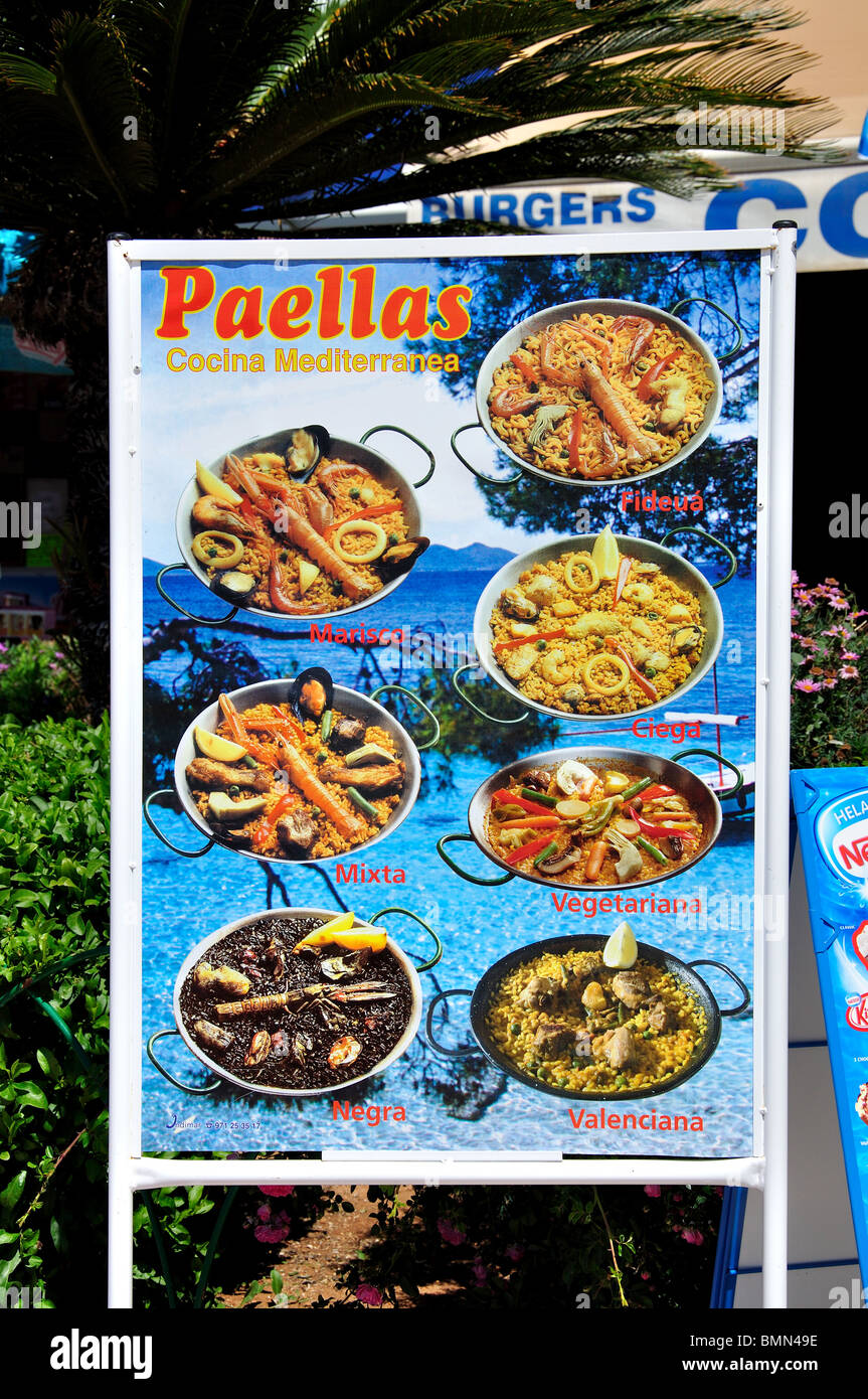 Paella selection board outside restaurant on beach promenade, Santa