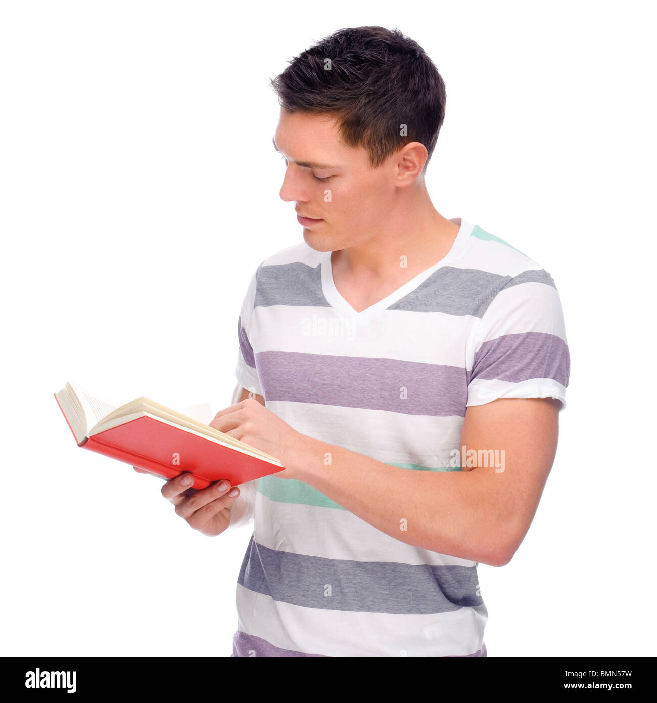 Full isolated studio picture from a young man with book Stock Photo - Alamy