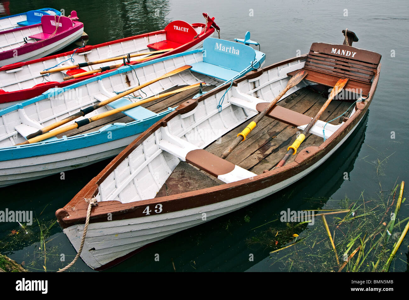 Group of rowing boats at Thorpeness boating lake Suffolk Stock Photo