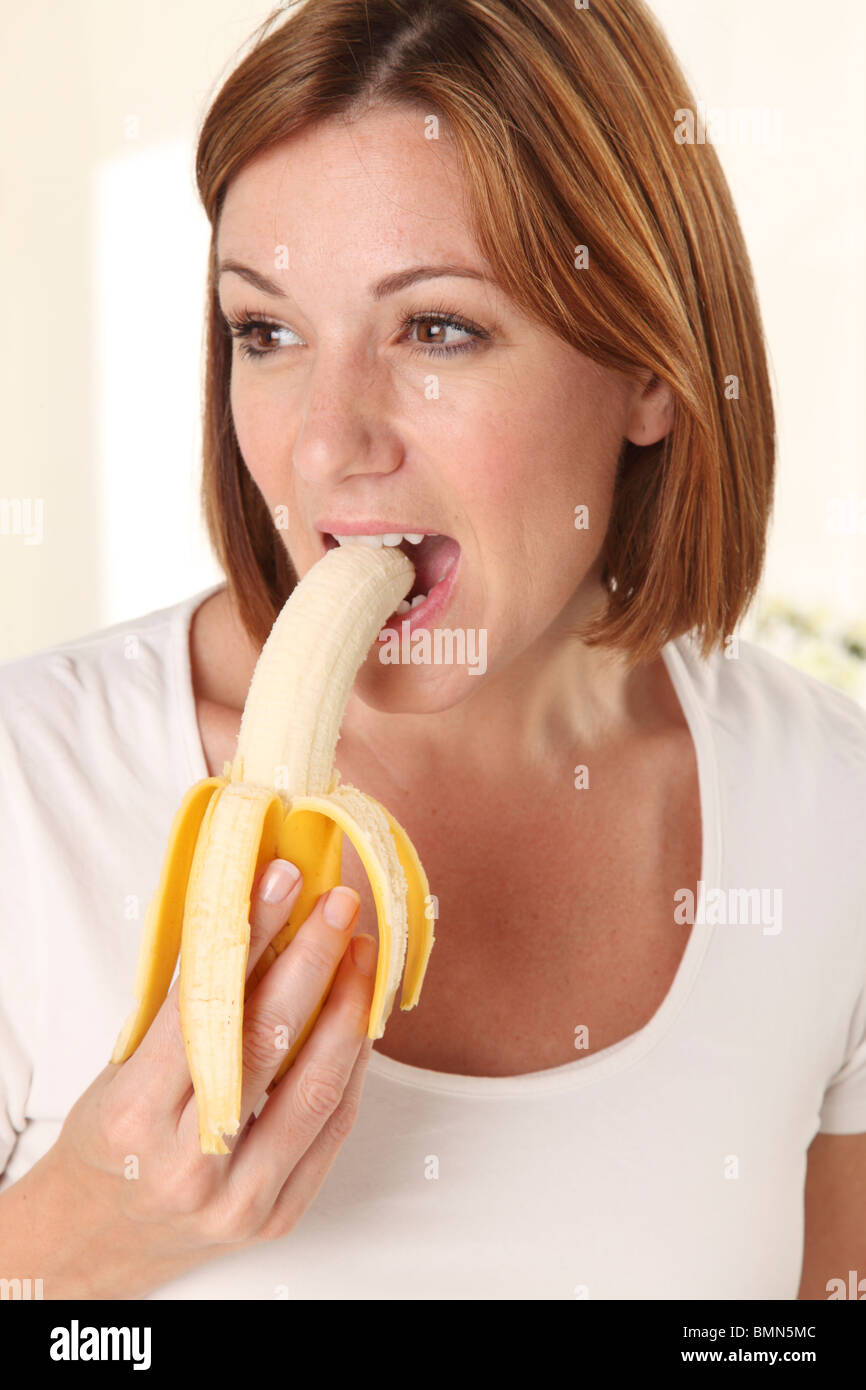 Woman eating bananas