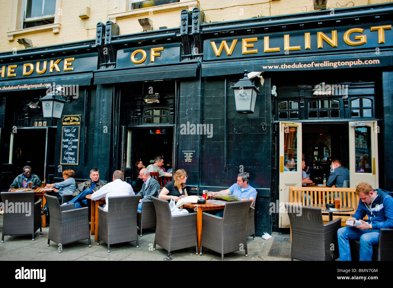 London, England, UK, people Sharing drinks on Portobello Road District