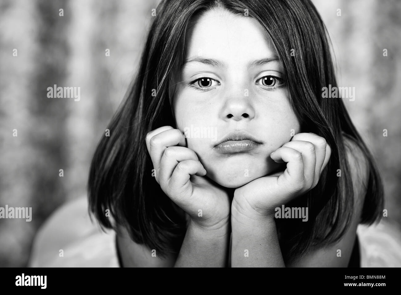 Powerful Black and White Image of a Pretty Young Child Thinking Stock Photo