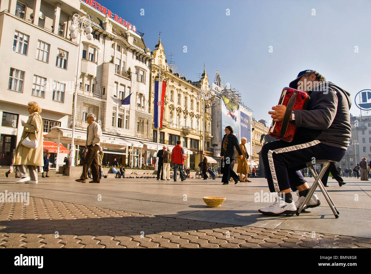 Man playing accordion for money in the streets of Zagreb, Croatia, Europe. Stock Photo