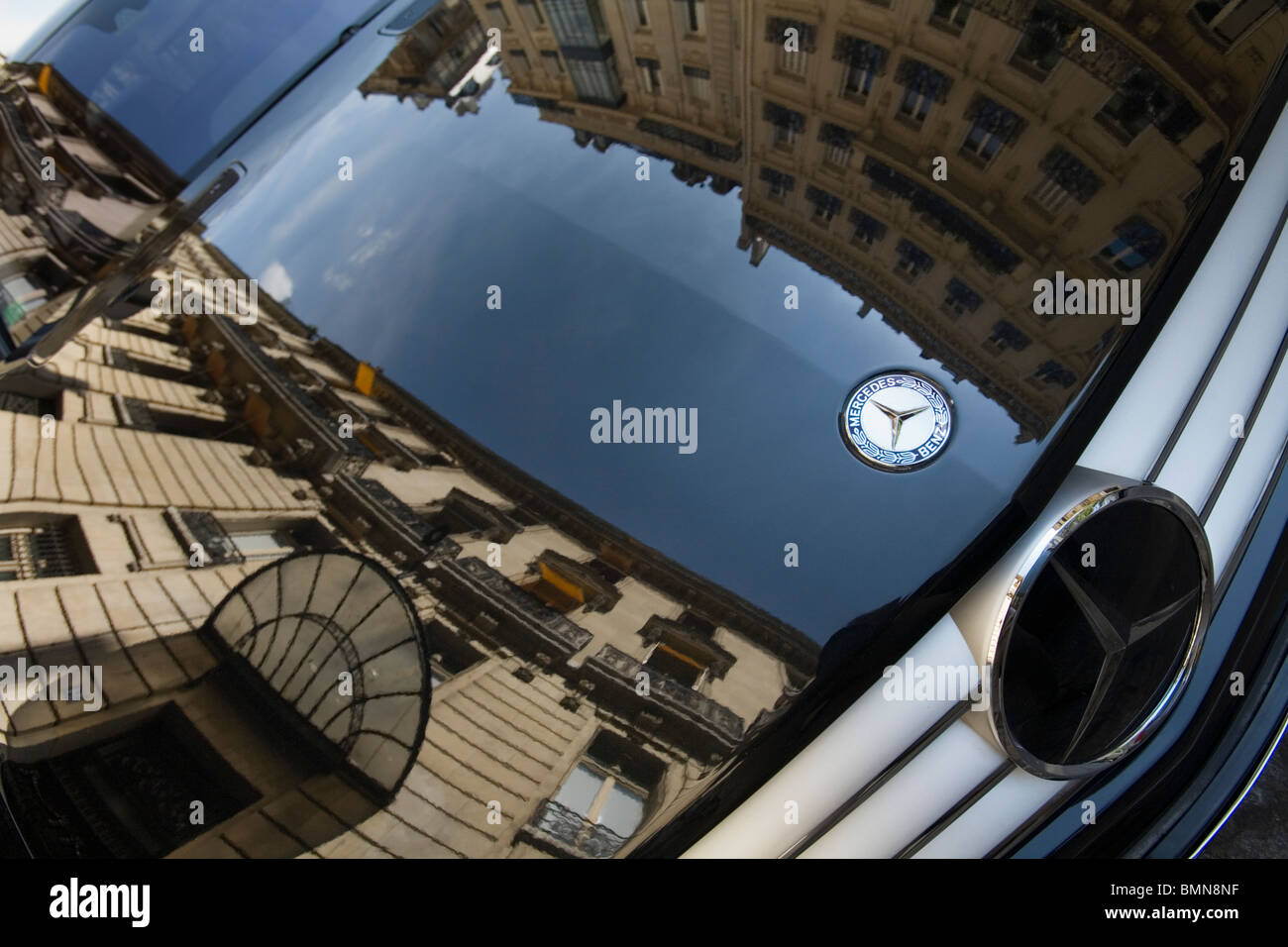 Houses Reflecting In a Mercedes Benz Black Shining Hood in Street, Paris Stock Photo