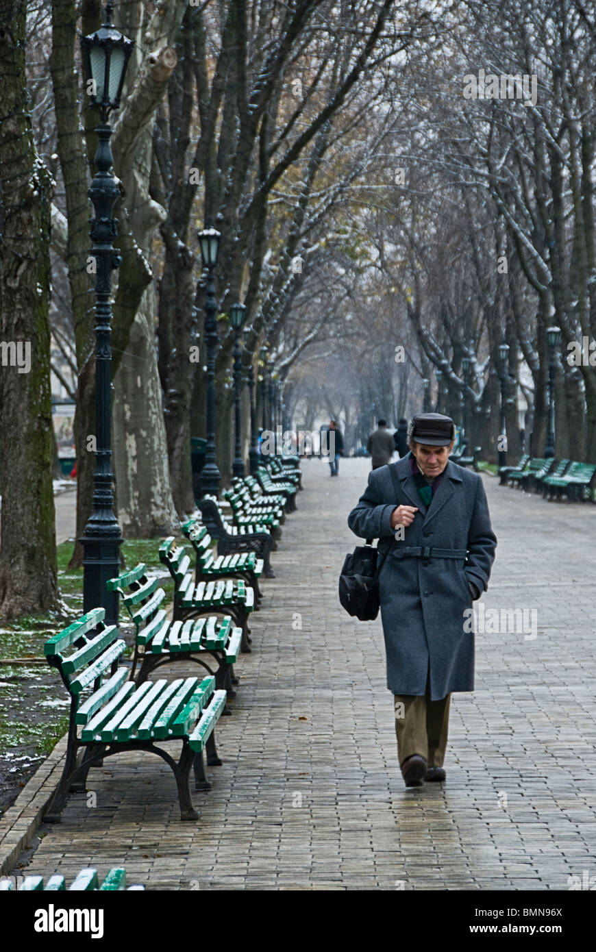 Old man walking in an avenue in Odessa. Ukranie, Europe Stock Photo