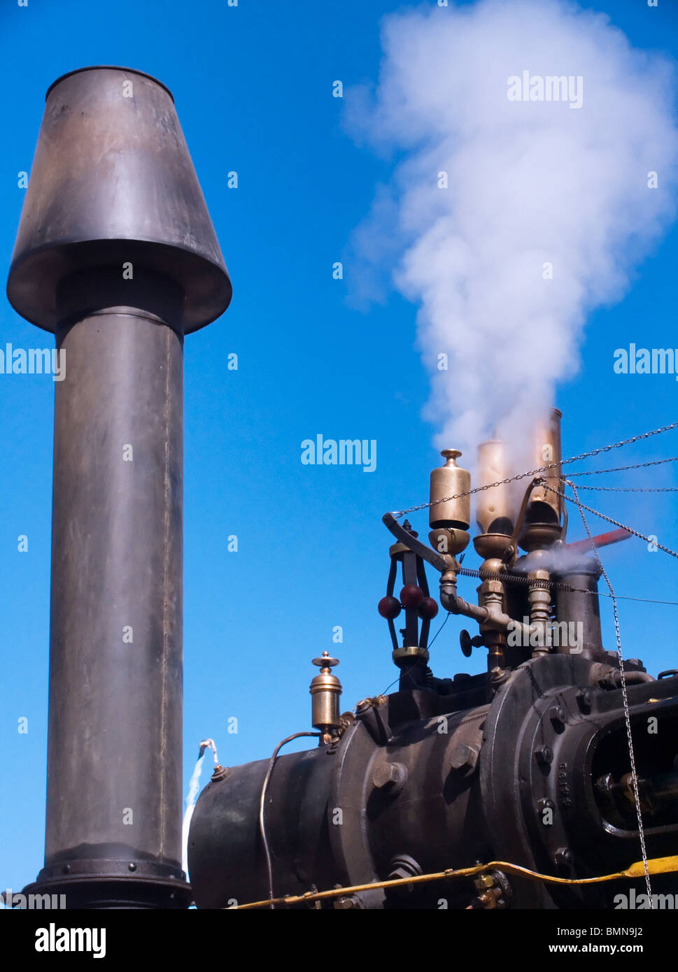 A steam machine blows off vapor and steam Stock Photo