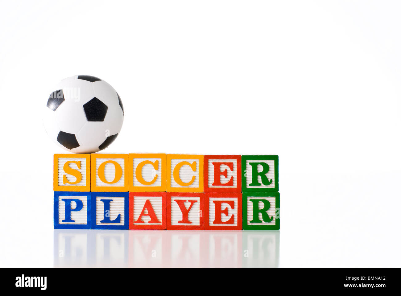 Colorful children's blocks spelling SOCCER PLAYER with a soccer ball