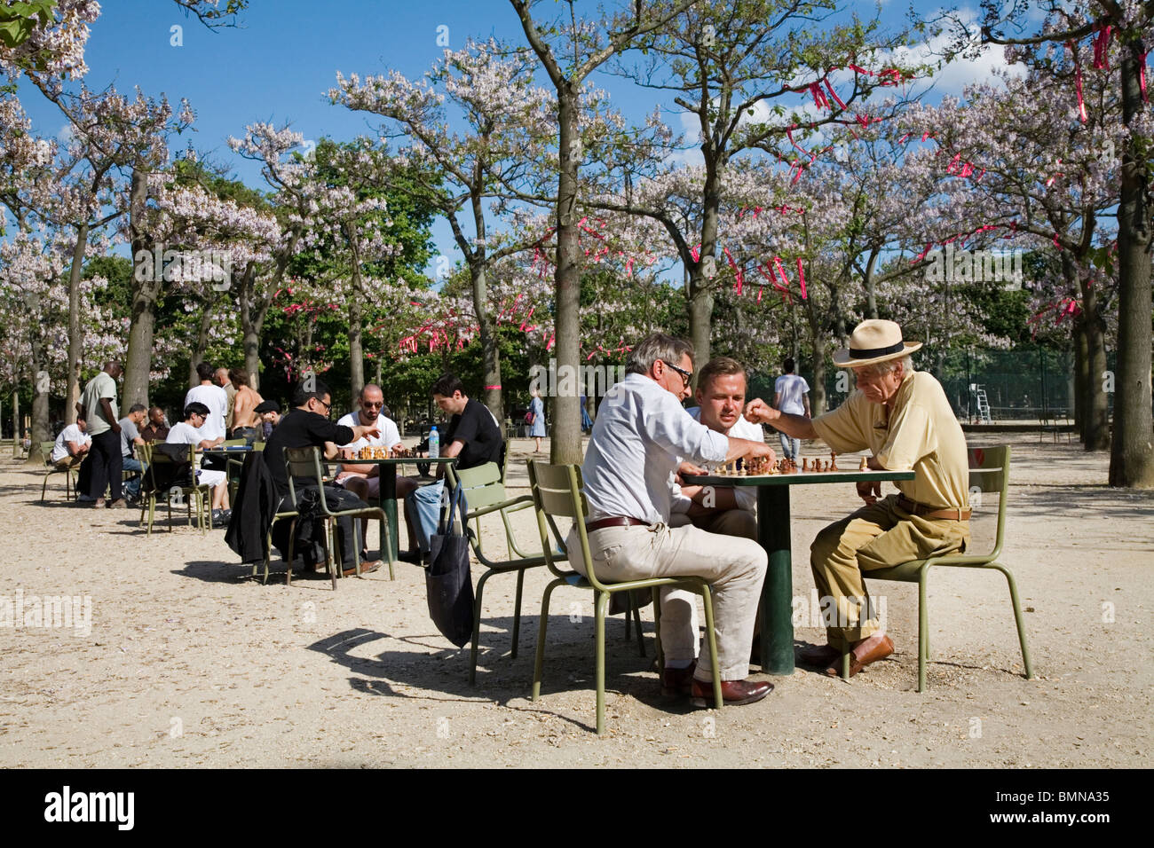 Old retired men playing chess at the Jardins du Luxembourg, Paris Stock