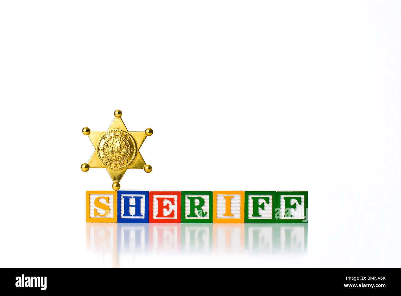 Colorful children's blocks spelling SHERIFF with a badge Stock Photo