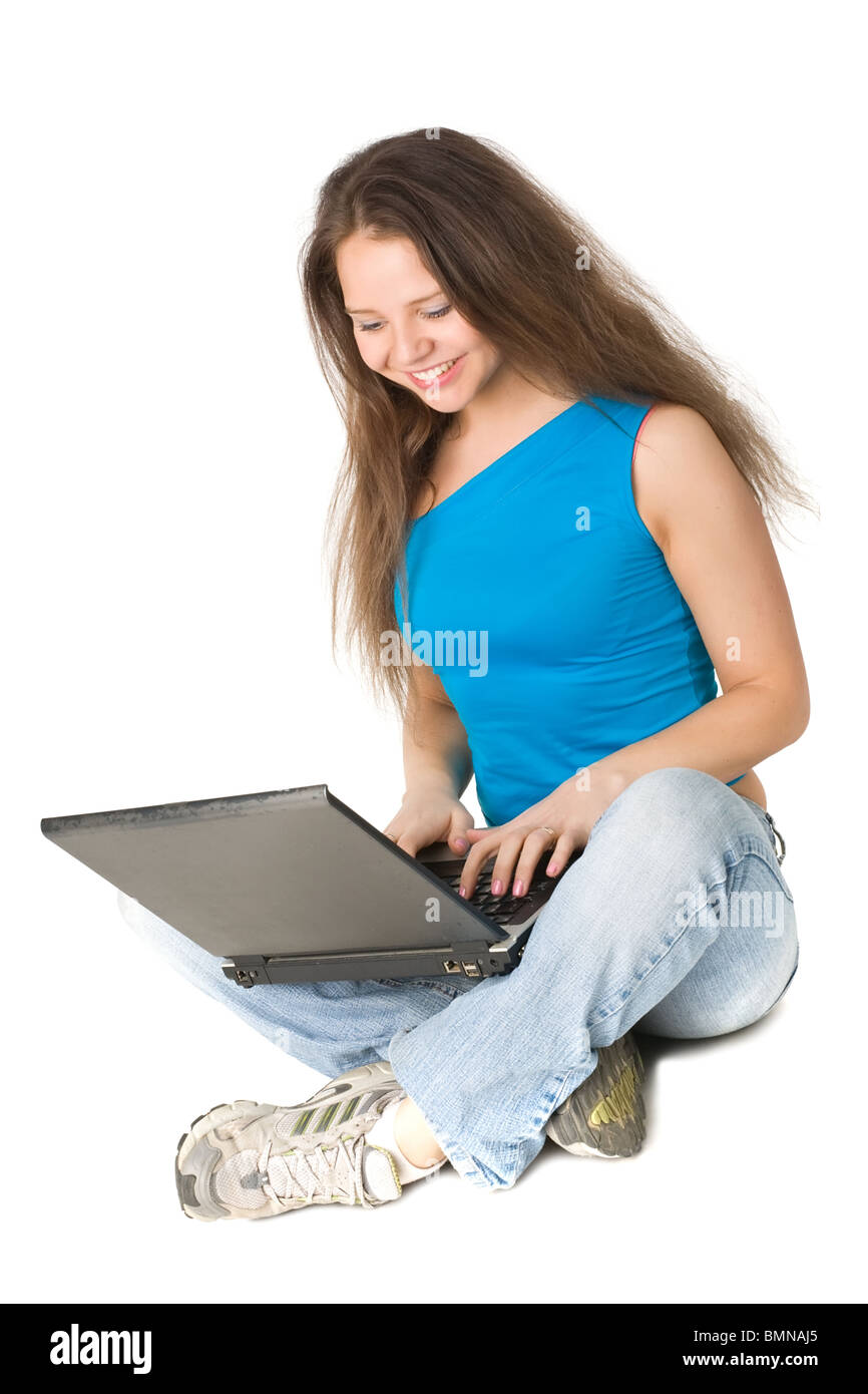 beautiful girl sits on a floor with the laptop, isolated on white Stock ...