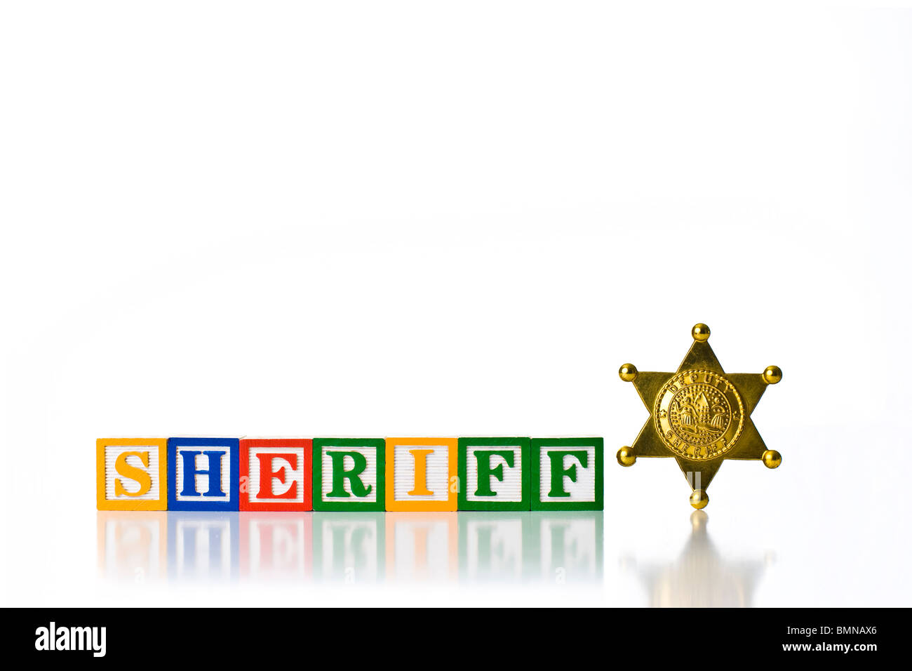 Colorful children's blocks spelling SHERIFF with a badge Stock Photo