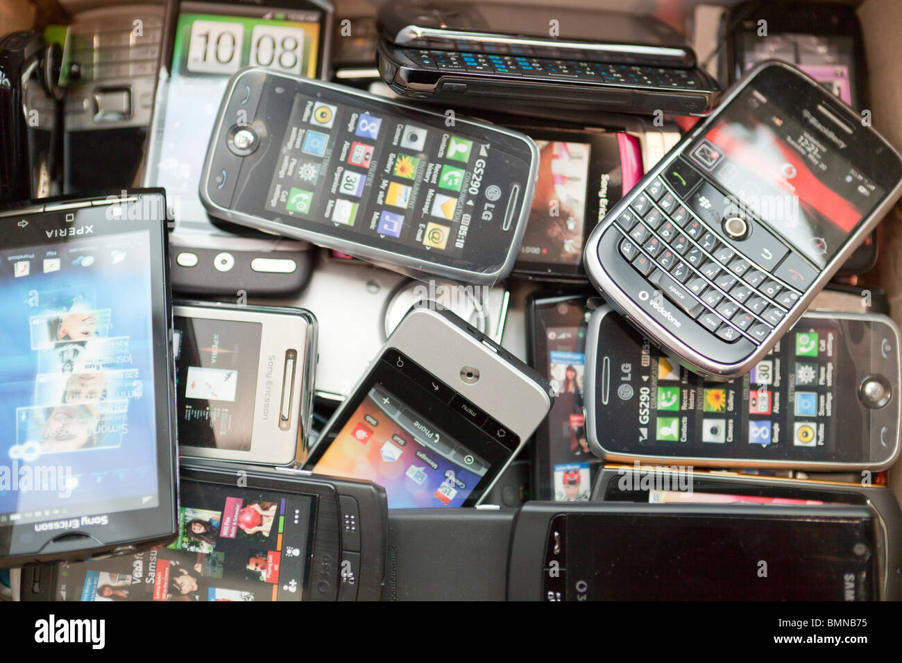 Pile of recycled mobile phones Stock Photo