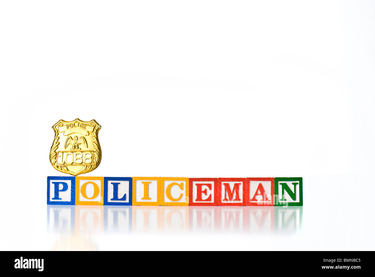 Colorful children's blocks spelling POLICEMAN with a badge Stock Photo