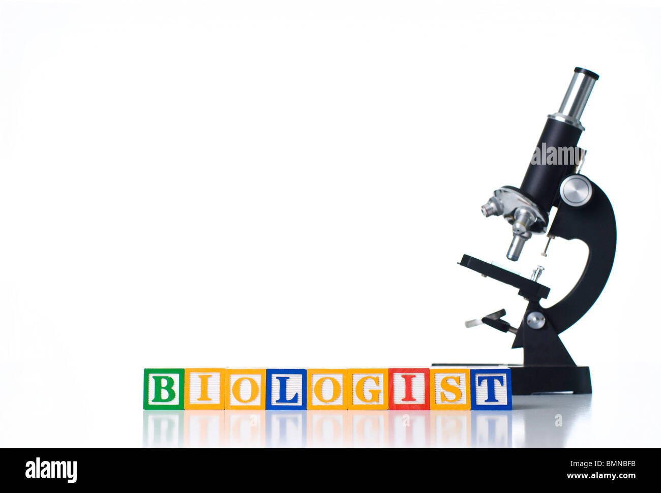 Colorful children's blocks spelling BIOLOGIST with a microscope Stock Photo