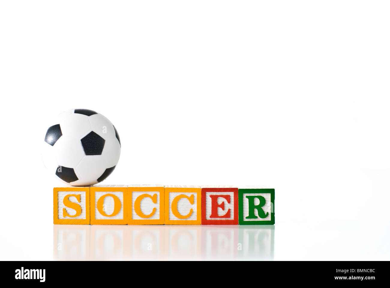 Colorful children's blocks spelling SOCCER with a soccer ball Stock