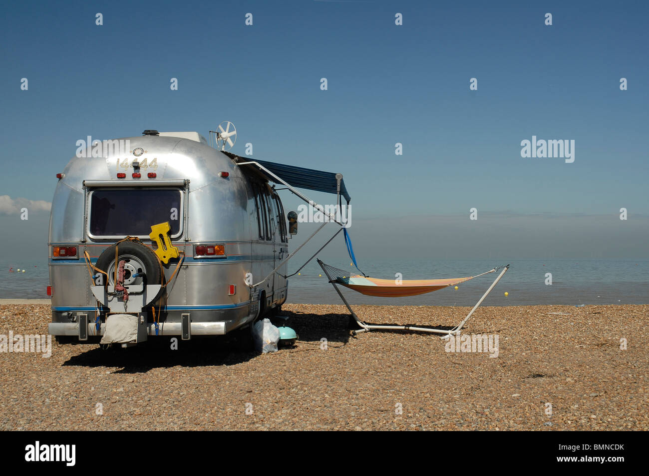 winnebago, campervan, beach scene, hammock, summer,camping, caravaning, motorhome, RV Stock