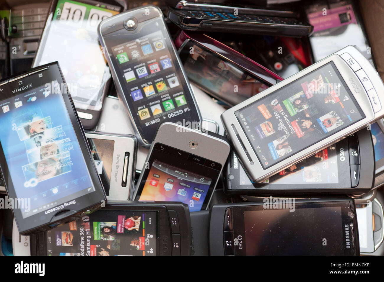 Pile of recycled mobile phones Stock Photo