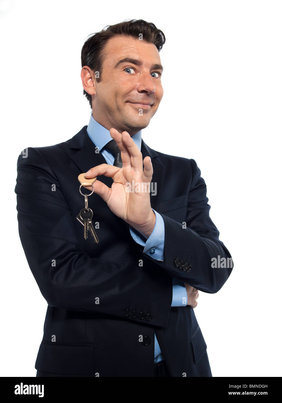 man real estate agent businessman offering keys isolated studio on white background Stock Photo