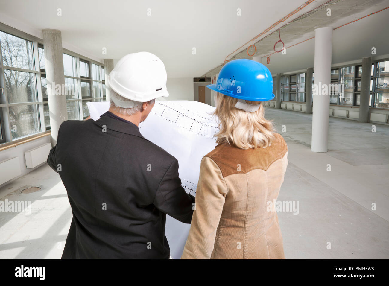 Two architects examine office building Stock Photo