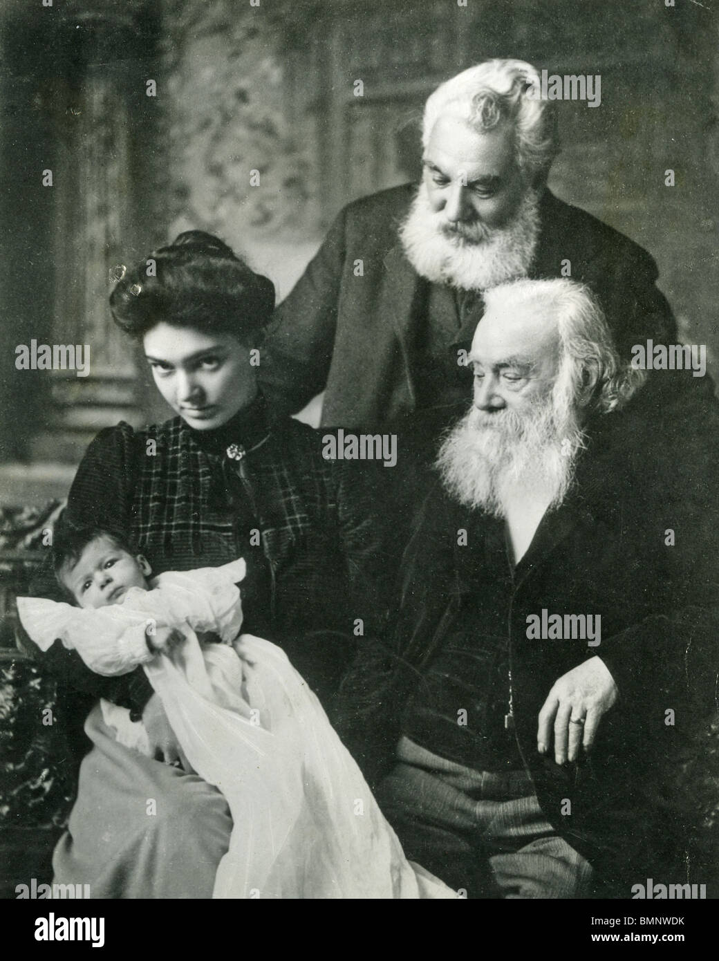 ALEXANDER GRAHAM BELL (standing) in 1902 with brother Melville and Mrs Bell Grosvenor and her baby also called Melville Stock Photo