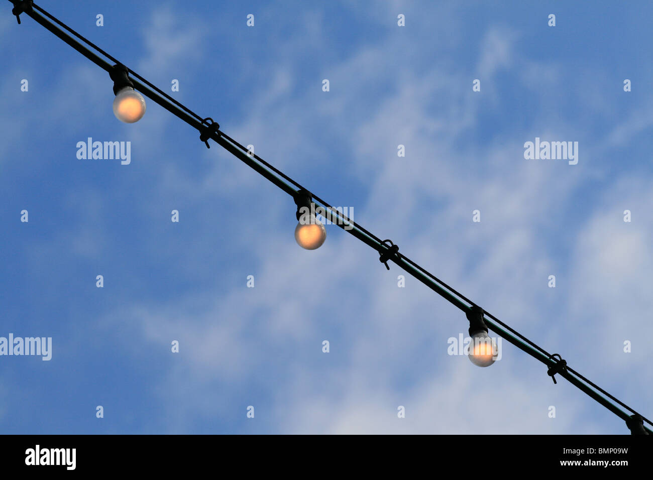 Chain of lights against blue sky Stock Photo Alamy