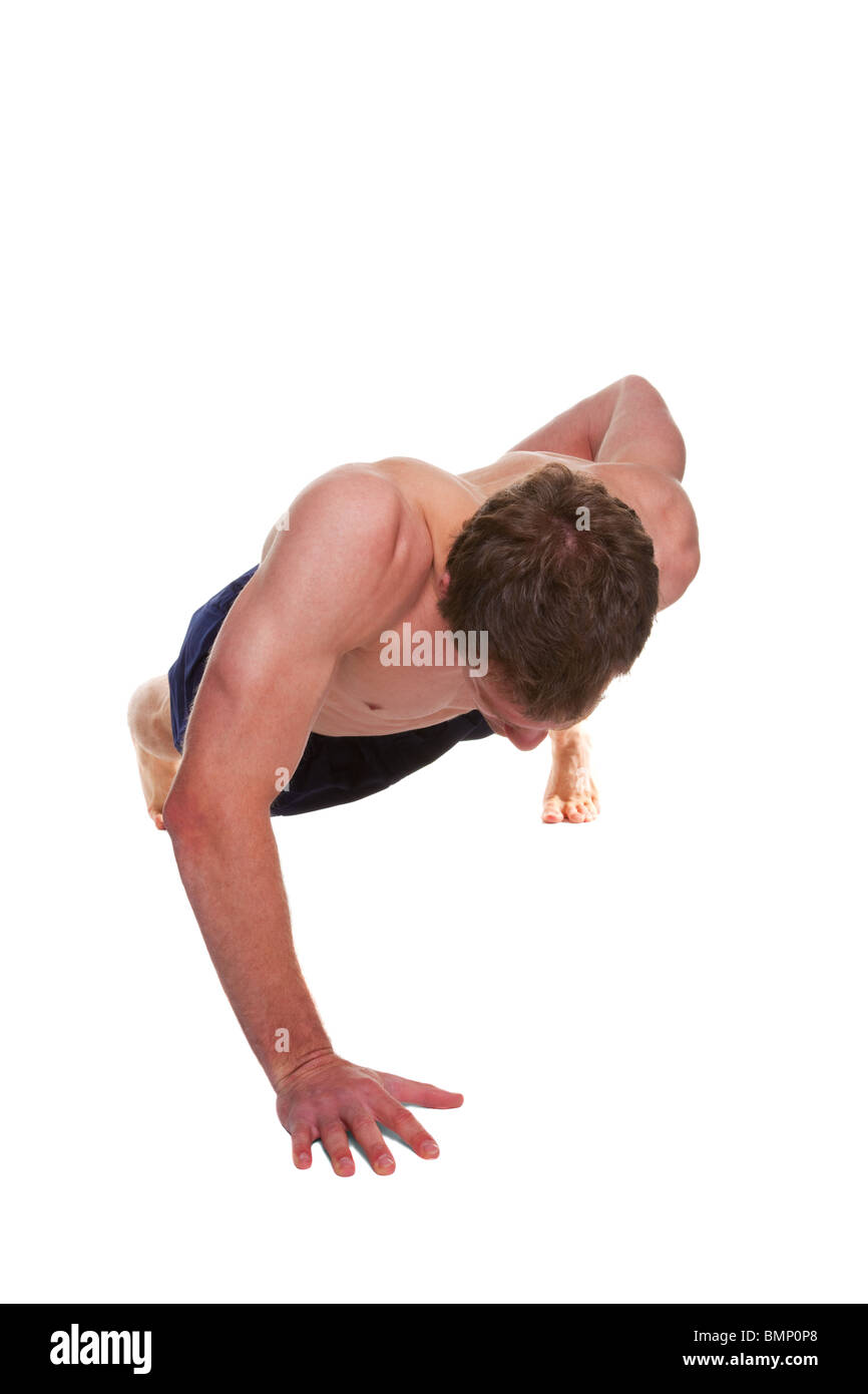 Man doing a one handed push up isolated on a white background Stock Photo