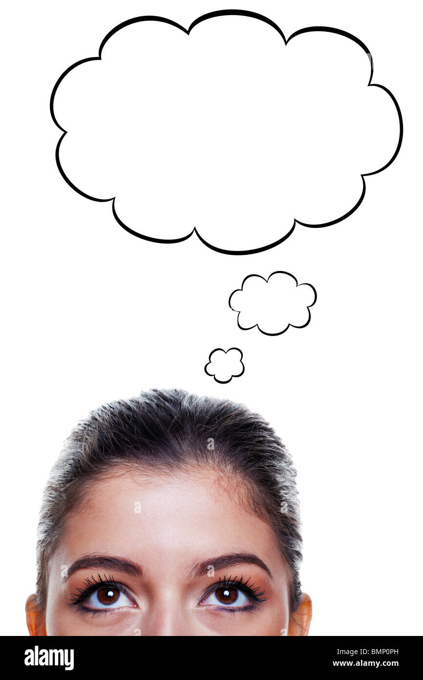 Brunette woman with big brown eyes looking upwards with thought bubbles above her head, isolated on white background. Stock Photo