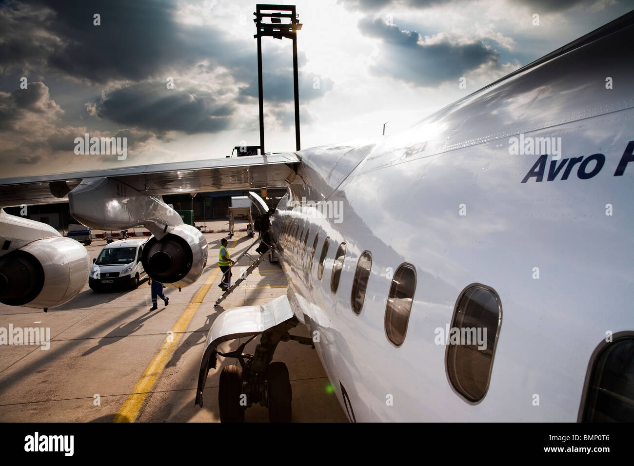 Passenger embark onto a Lufthansa Regional Airliner at Frankfurt International Airport Stock Photo