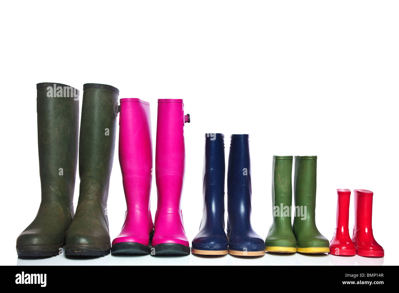 A group of wellie boots isolated on a white background. Stock Photo