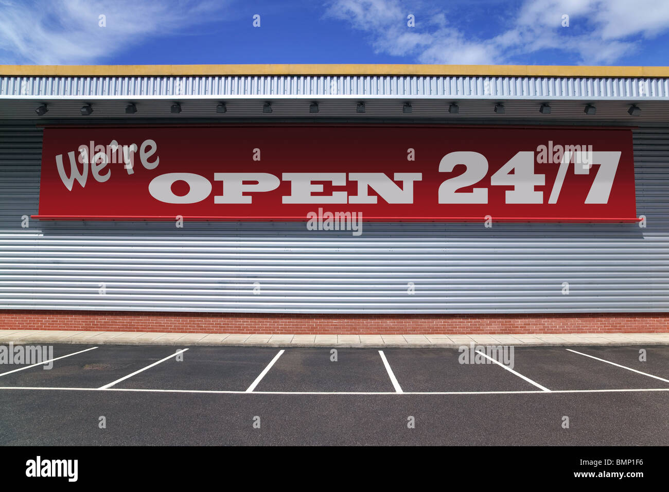 Billboard on a retail building with notice saying We're open 24/7 Stock Photo