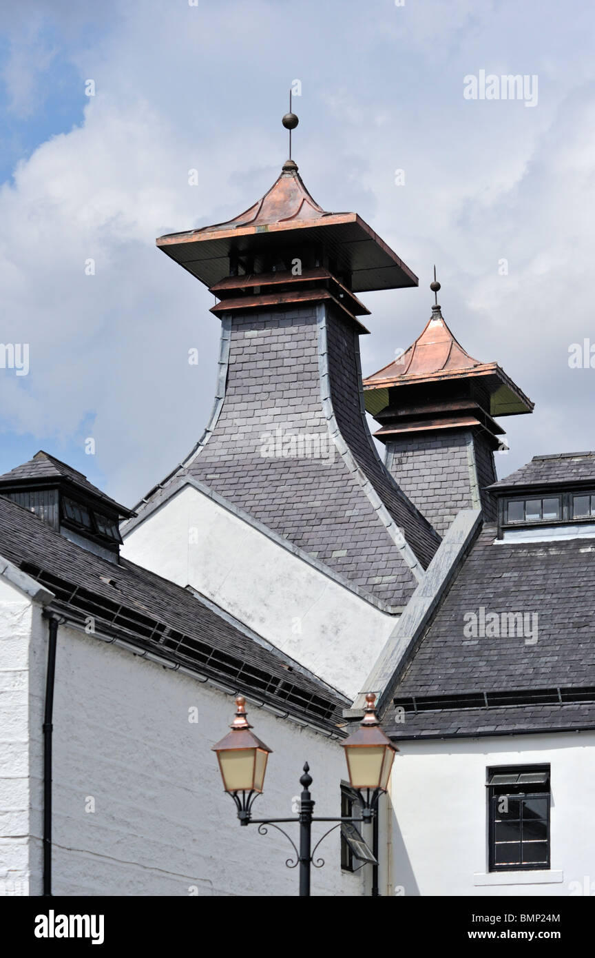 The pagoda roofs above the malt drying kilns. Dalwhinnie Whisky Distillery, Dalwhinnie, Inverness-shire, Scotland, U.K., Europe. Stock Photo