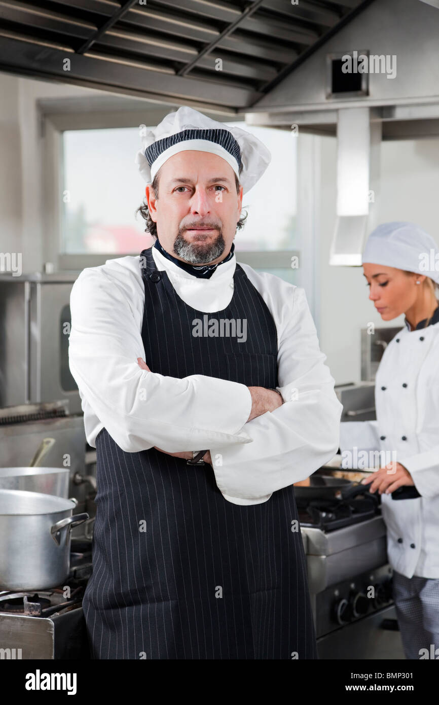 Portrait of confident chef looking at camera in kitchen stock photo  alamy