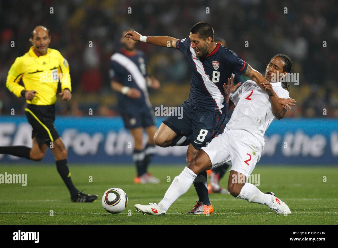 Clint Dempsey of the United States (8) battles Glen Johnson of England (2) during a 2010 FIFA World Cup football match. Stock Photo