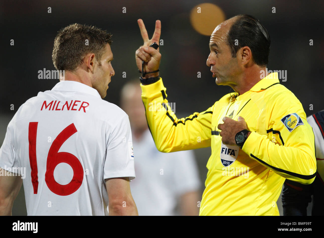 James Milner of England about to be booked by referee Carlos Simon during a 2010 FIFA World Cup football match against the USA. Stock Photo