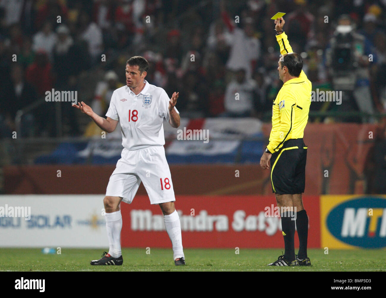 Jamie Carragher of England is booked by referee Carlos Simon during a 2010  FIFA World Cup football match against the USA Stock Photo - Alamy