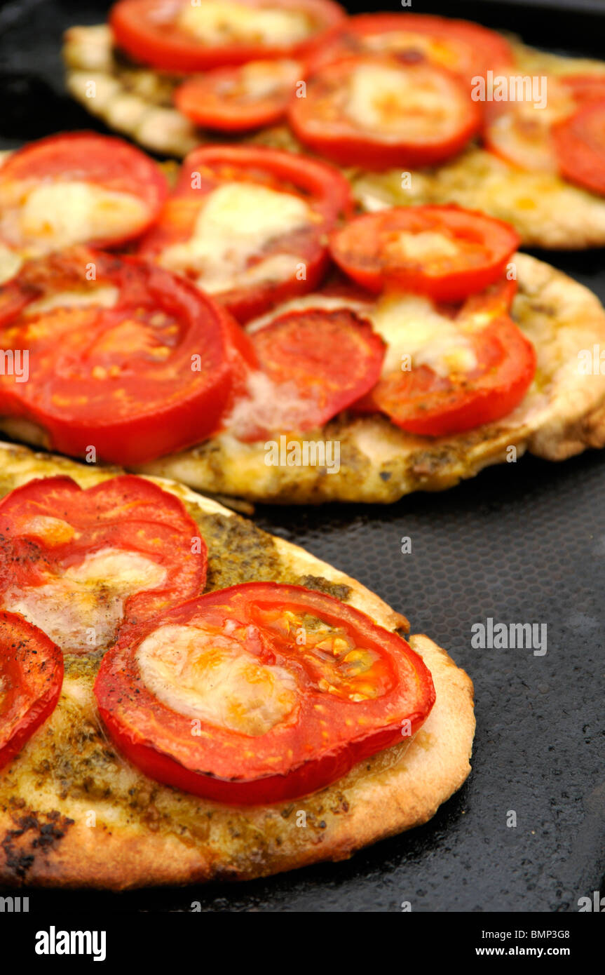 Pita bread with tomato and melted cow Mozzarella cheese toppings Stock