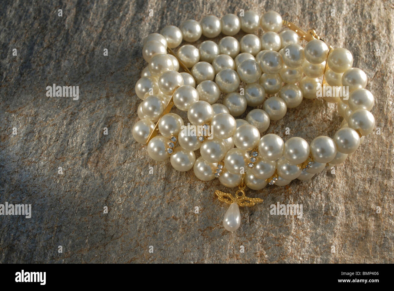 pearl and diamond necklace on the stone Stock Photo - Alamy