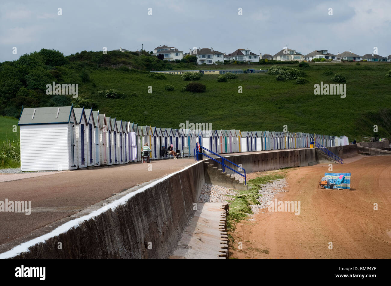 Beach huts at Broadsands,Paignton,Devon,cliff cliffs rocks rocky shore