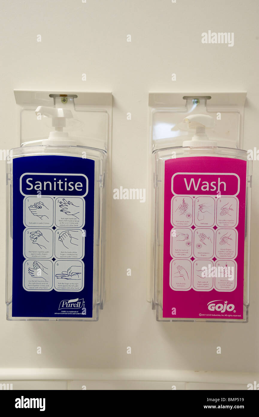 Wall mounted dispensers of sanitizing disinfectant and soap at hospital