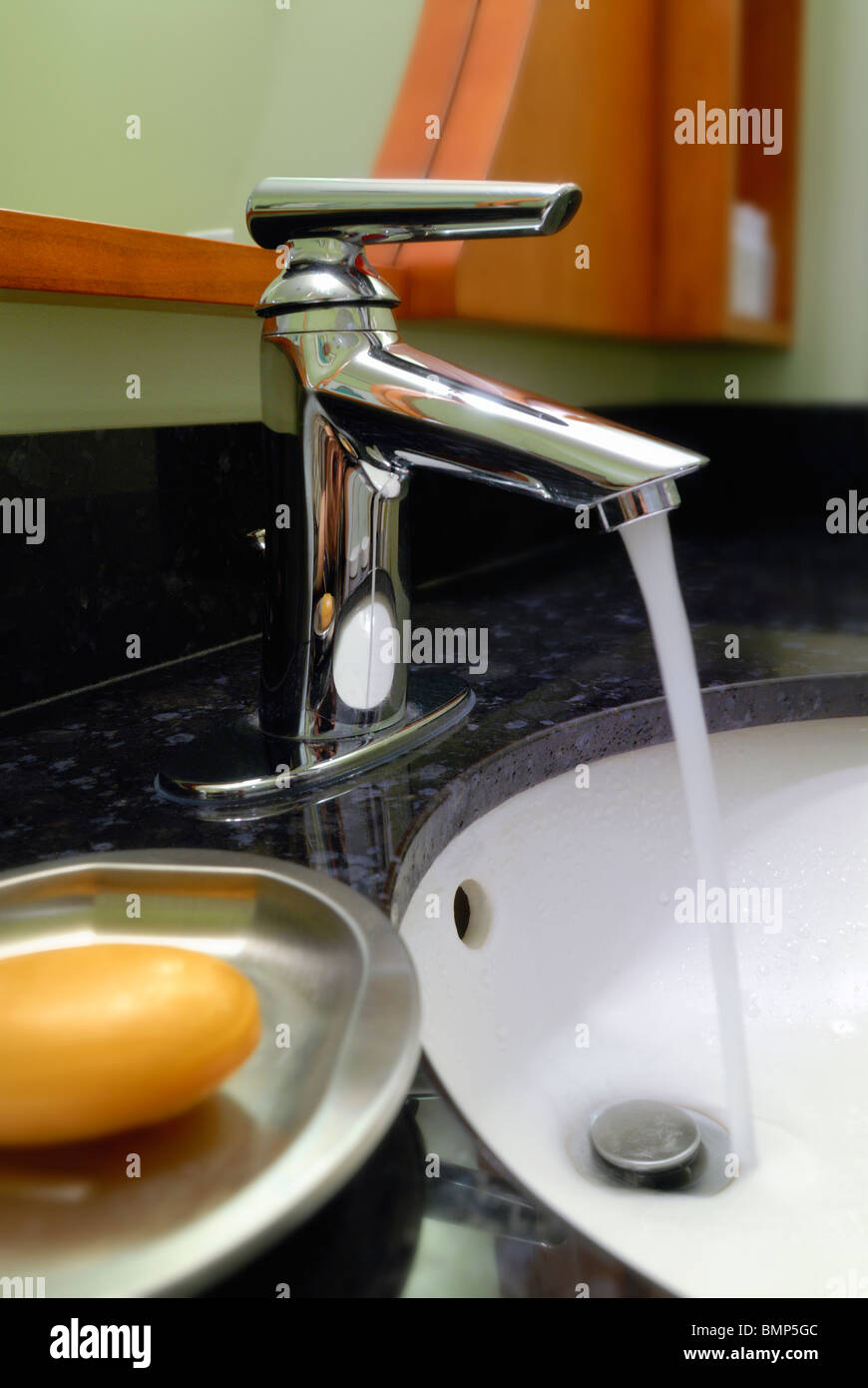 Running water at the bathroom sink Stock Photo Alamy