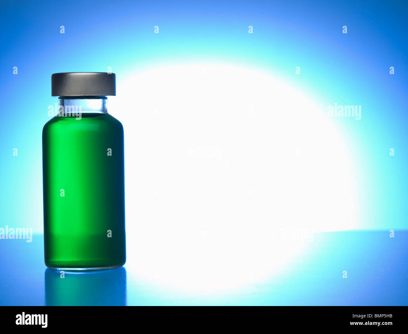 Close up of a vial filled with green liquid. Copy space. Stock Photo
