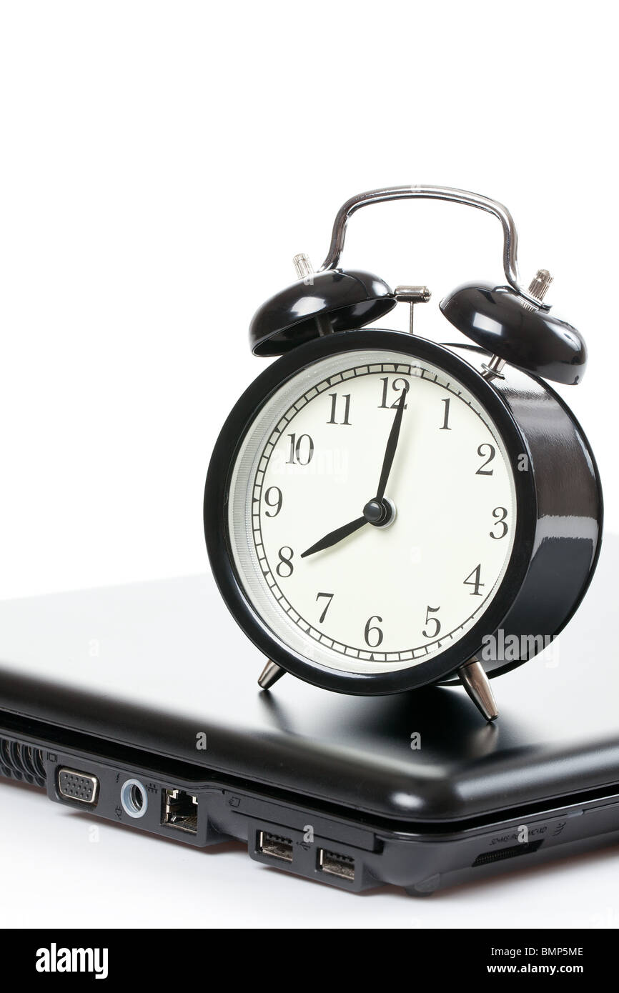 alarm clock and laptop on white background Stock Photo Alamy