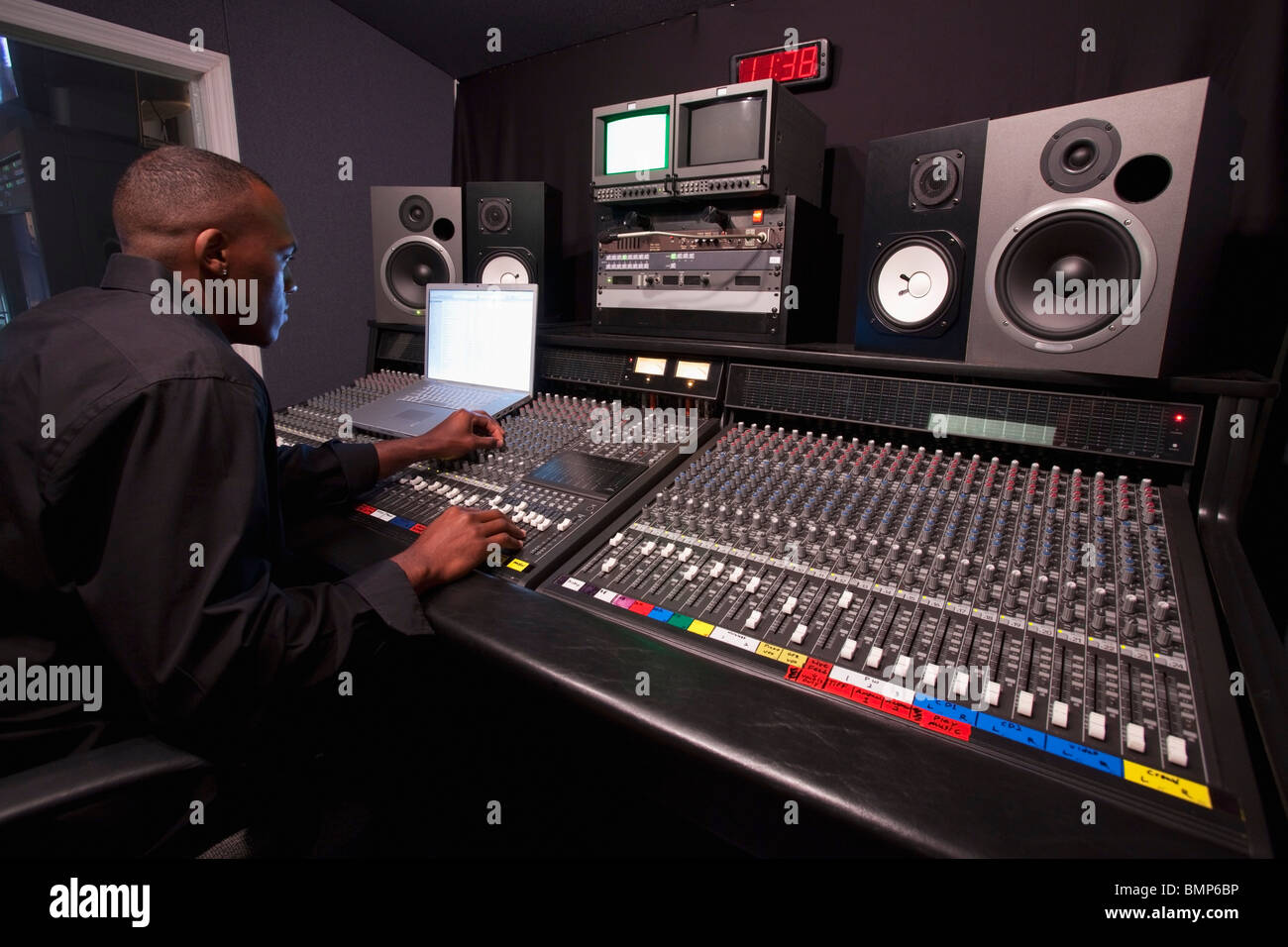 Fort Lauderdale, Florida, United States Of America; A Man Using A Sound Board In A Recording Studio Stock Photo