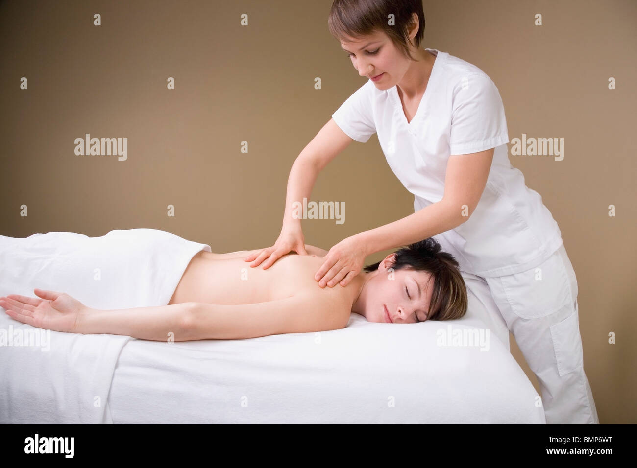 A Woman Getting A Massage From A Massage Therapist Stock Photo - Alamy