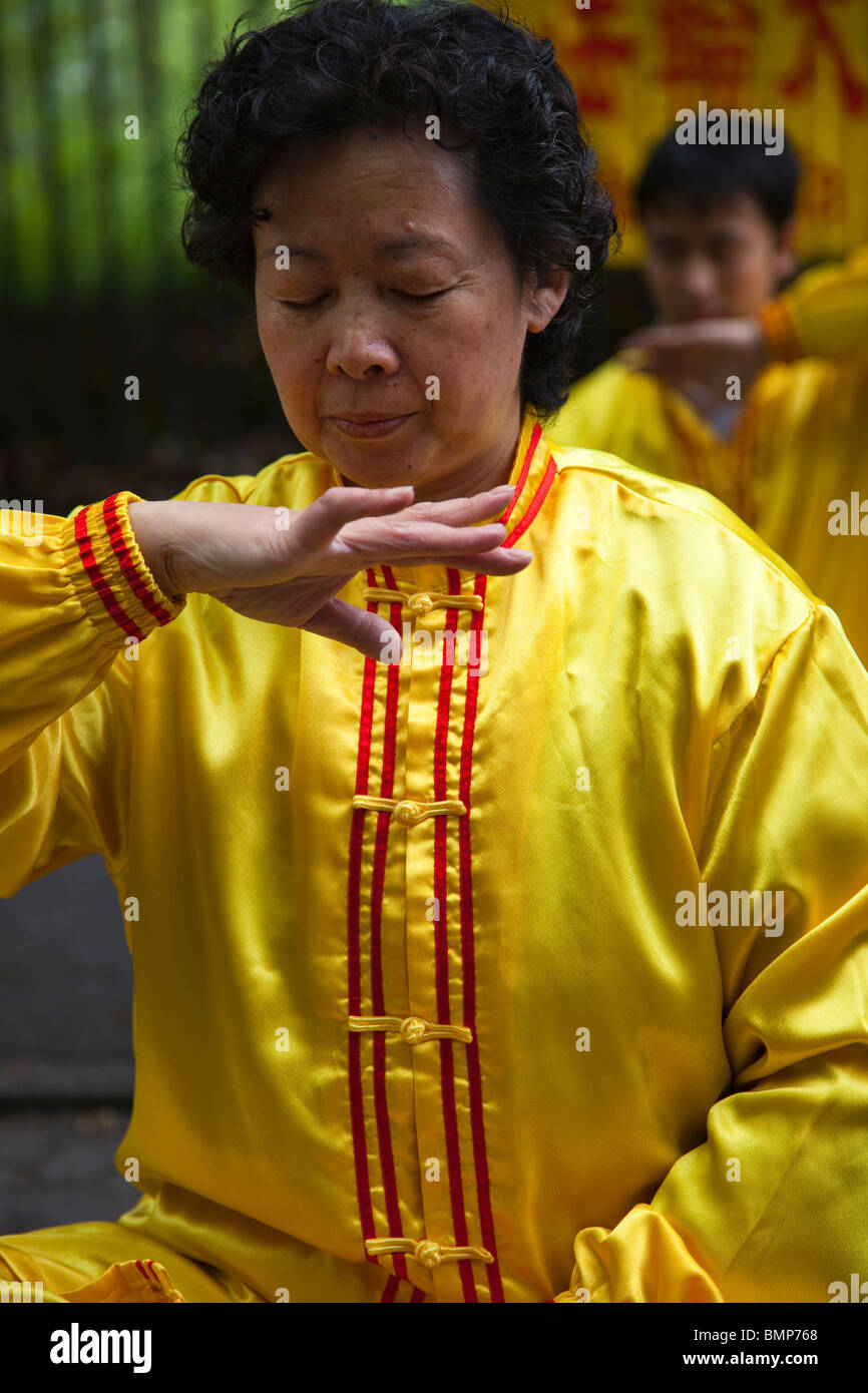 Woman practising Falun Gong, a form of Chinese meditation exercises in